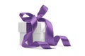 Present box with purple ribbon