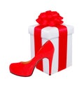 Present box with red bow and woman shoe Royalty Free Stock Photo