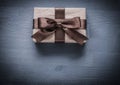 Present box on vintage wooden board holiday concept Royalty Free Stock Photo