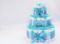 Present cake with diapers for newborn baby boy Royalty Free Stock Photo