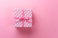 Present gift box on pink background