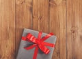 Present in gift box on wood background with copy space Royalty Free Stock Photo