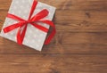 Present in gift box on wood background with copy space Royalty Free Stock Photo