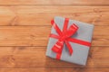 Present in gift box on wood background with copy space Royalty Free Stock Photo