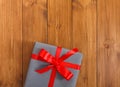 Present in gift box on wood background with copy space Royalty Free Stock Photo