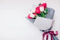 Present gift for Mother`s day. Spring flowers for International Women`s day. Bouquet of white and pink tulips