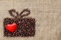 Present made of coffee beans with red heart