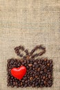 Present made of coffee beans with red heart