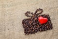 Present made of coffee beans with red heart