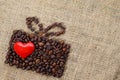 Present made of coffee beans with red heart