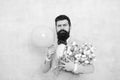 Present for spouse. Guy with air balloon. Birthday party. Bearded man hipster with flower bouquet. 8 march. Flowers for