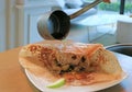 Presentation of Apple Raisin Crepe Flambe on Guest Table