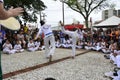 Presentation of Capoeira a traditional art in Brazil in the city square with many people watching