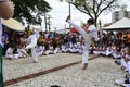 Presentation of Capoeira, a traditional art sport in Brazil, in a city square with many people