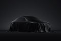 Presentation of the car covered with a black cloth. 3d rendering
