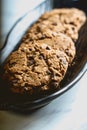 presentation of chocolate biscuits on a black plate