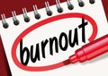 The word burnout noted on a notepad
