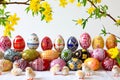 Presentation of variously hand-painted Easter eggs on a white background. Royalty Free Stock Photo