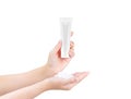 Presented Hands holding blank cosmetic white tube and whip facial foam for face cleansing