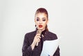 Presenter, girl having speech presentation. Business woman speaker speaking at microphone mic reading from papers isolated on Royalty Free Stock Photo