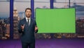 Presenter showing green screen reporting breaking news in tv channel studio. Royalty Free Stock Photo