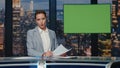 Presenter showing mockup screen reporting breaking news in tv channel studio Royalty Free Stock Photo