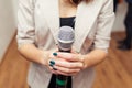 Presenter on stage with microphone. Wedding MC. Toastmaster.