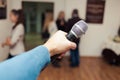 Presenter on stage with microphone. Wedding MC. Toastmaster.