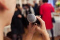 Presenter on stage with microphone. Wedding MC. Toastmaster. Royalty Free Stock Photo