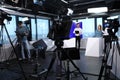 Presenters, makeup artist and camera operator working in studio. News broadcasting Royalty Free Stock Photo