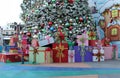 Presents and a little boy near the Grinchmas Christmas tree at Universal Studios Hollywood in LA