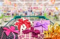 Presents ribbon gift box in shopping trolley cart