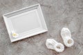 Presents set for baby shower with frame gray stone background top view mockup