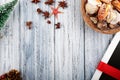 Presents wrapped with red ribbon, new year`s attributes and basket with sea shells on vintage wooden background Royalty Free Stock Photo