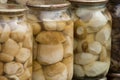The preserve mushrooms. Delicious marinated white mushrooms in the glass jars