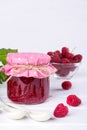 Preserved berry. Glass jar with homemade raspberry jam