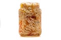 Preserved cabbage and red paprika salad in glass jar on a white background Royalty Free Stock Photo