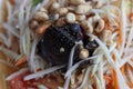 Preserved crab with salt in papaya salad or Thai people call Som Tam Poo is a famous food.