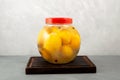 Preserved fermented lemons in glass jar. Clever food storage. Savory Salted country lemons. Traditional Moroccan cuisine