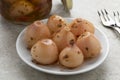 Preserved Lampascioni, Tassel grape, on a plate close up