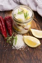 Preserved Lemons with salt on a wooden board Royalty Free Stock Photo