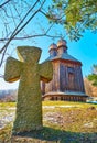 The Cossack grave stone and old wooden church of St Michael, Pyrohiv Skansen, Kyiv, Ukraine