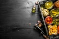 Preserved vegetables and mushrooms in a box with seamer. Royalty Free Stock Photo