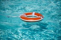 Preserver lifebuoy. Orange lifebuoy in sea on water. Life ring floating of water. Royalty Free Stock Photo