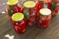 Preserves vegetables in glass on wood background, marinated fermented and pickled fermer food