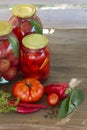 Preserves vegetables in glass on wood background, marinated fermented and pickled fermer food