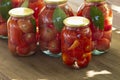 Preserves vegetables in glass on wood background, marinated fermented and pickled fermer food