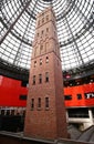 Preserving old historic brick Coop`s Shot Tower indoor under modern black steel truss glass dome inside Melbourne Central Mall Royalty Free Stock Photo