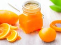Zesty Delight: Tangy Orange Jam Adorns a Tempting Table Setting
