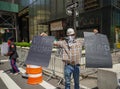 President Donald Trump supporter with signs `Vote Trump` in front of Trump Tower at 5th Avenue in Manhattan